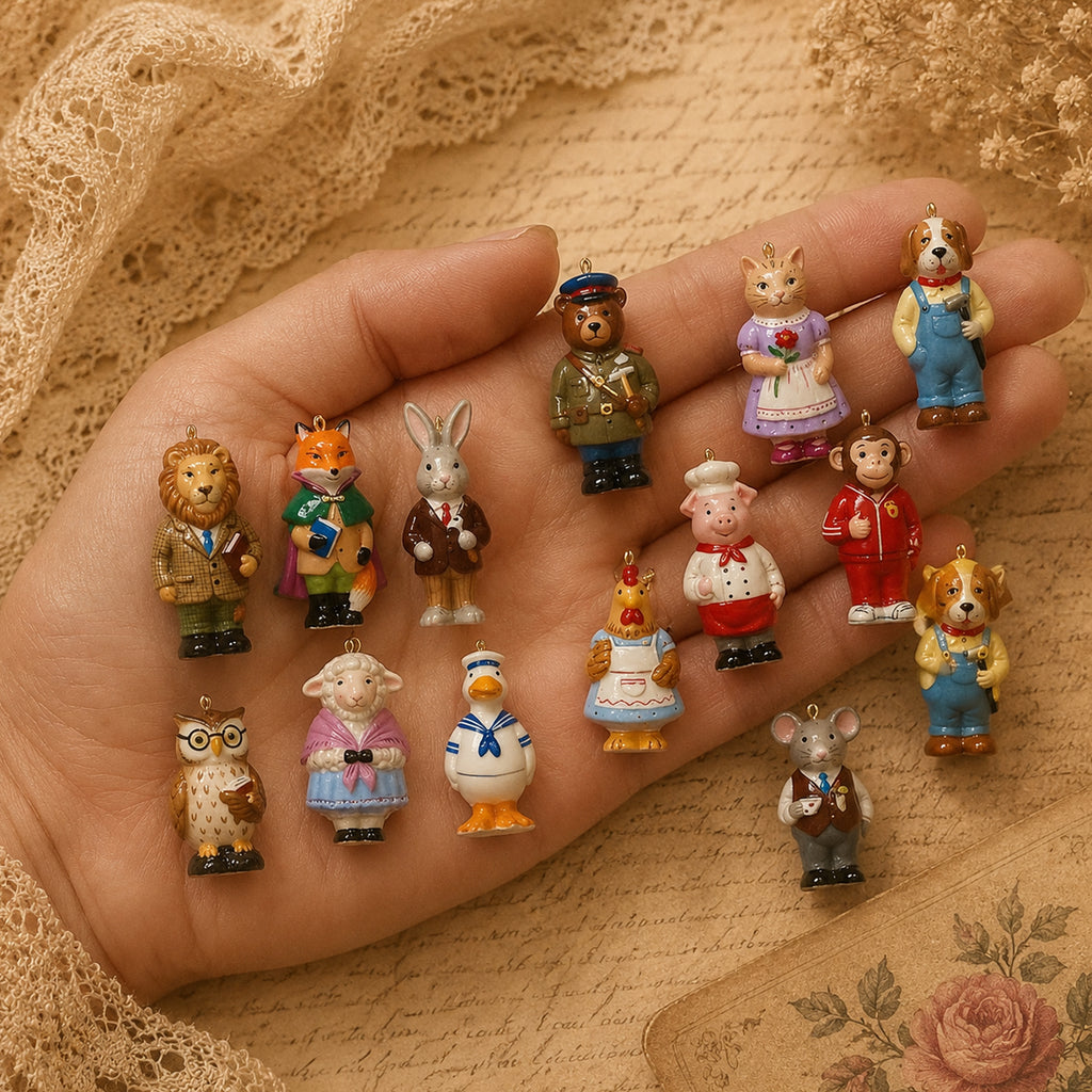 Sixteen small Animal Forest character charms resting across a hand to show their scale.