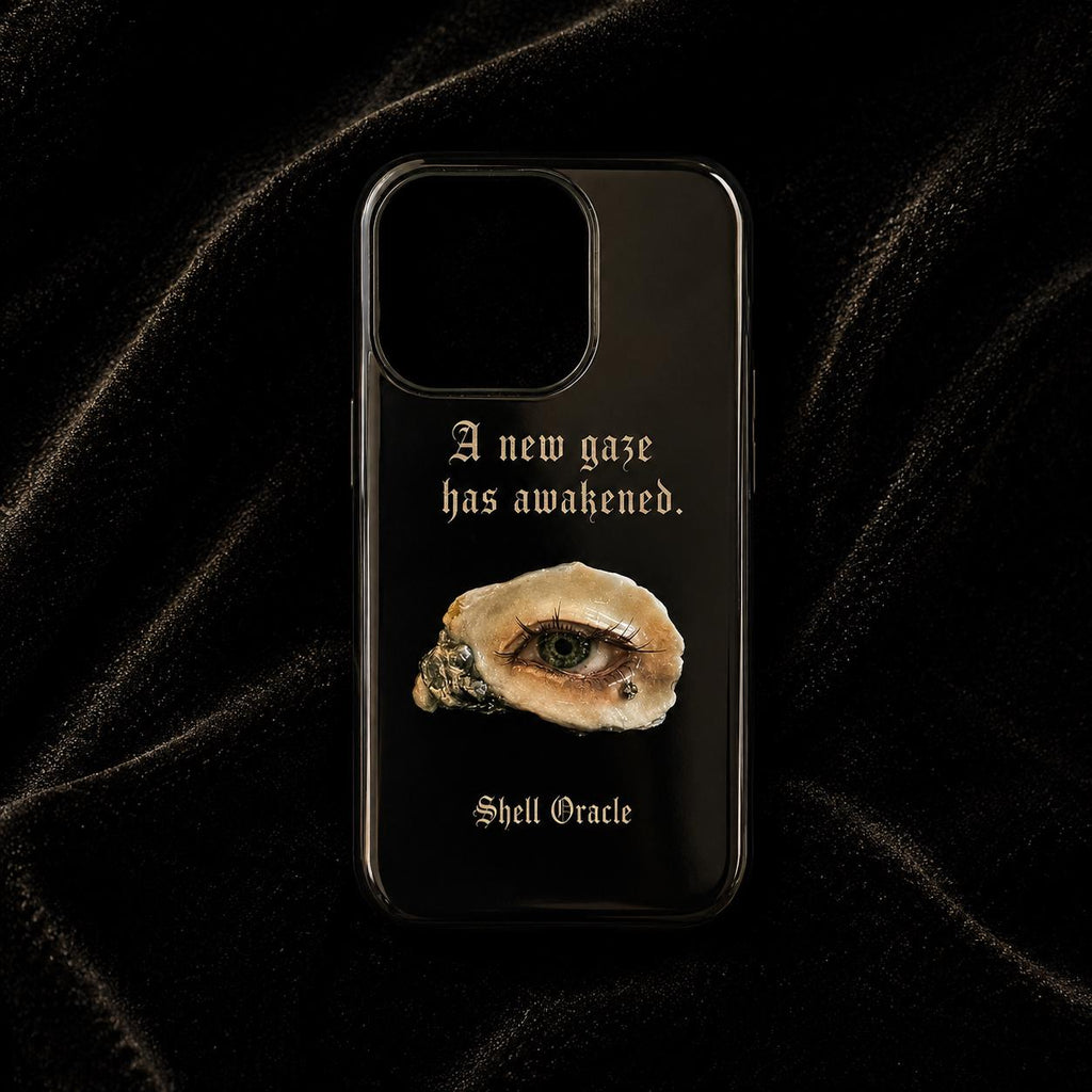 Black Shell Oracle phone case with a brown shell-eye print and gold-toned Gothic lettering.