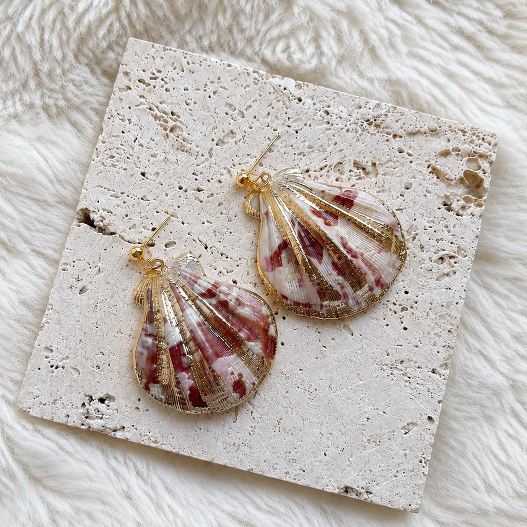 Pair of large fan-shell earrings with red, cream and gold-toned stripes.
