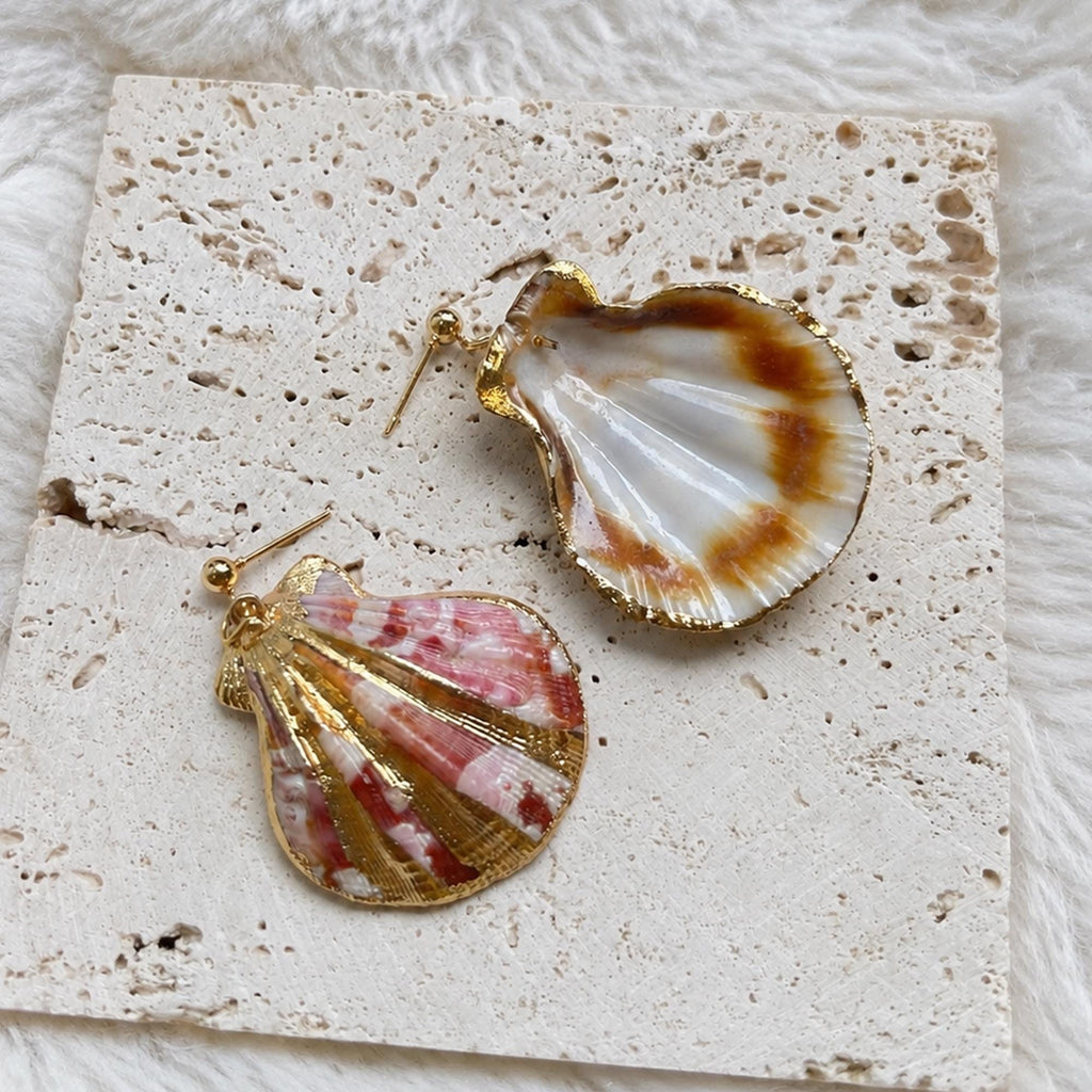 Front-and-back comparison of striped fan-shell earrings with gold-tone edging.