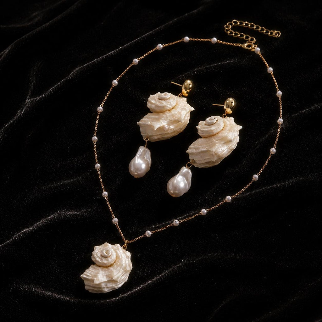 Coordinated conch-shell necklace and earring designs arranged in an oval on black velvet.