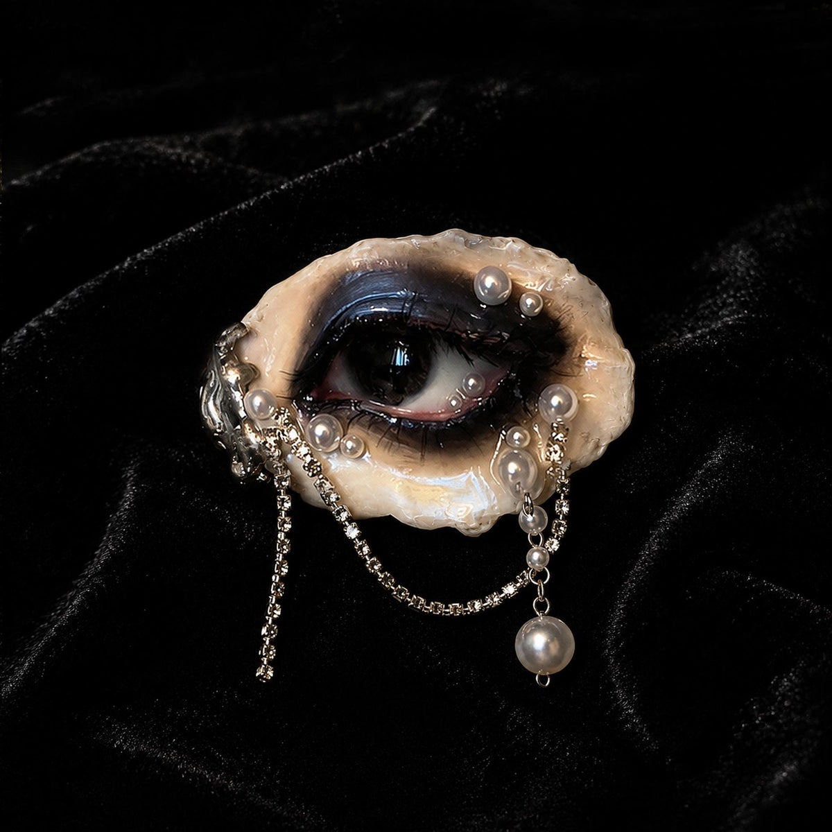 Front view of Lilith Veil Black Smoky oyster eye showing dark makeup and hanging pearl-like drops.