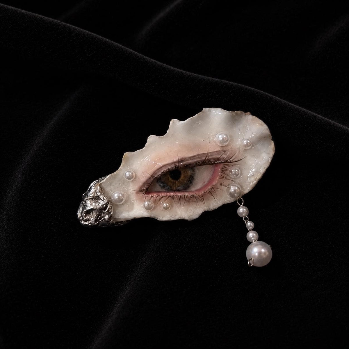 Angled view of Nyra Halo Brown Eye with pink smoky makeup and a pale shell.